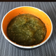 Salsa verde. Just roast tomatillos (peel the paper off first), jalapeño (stem, peel after roasting, and seed), and onion. Add these and some fresh cilantro to a food processor and run on low until all the large chunks are gone. If too bitter, add small amounts of sugar and mix until it is neutralized.